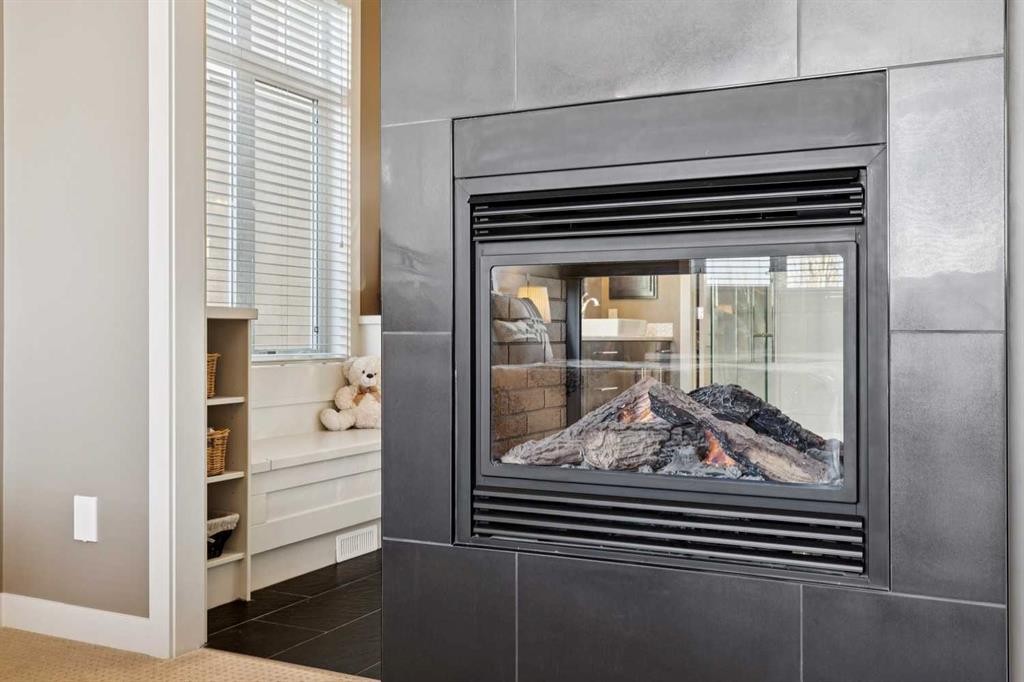44 Aspen Summit Drive Sw, Calgary, AB - Indoor Photo Showing Other Room With Fireplace