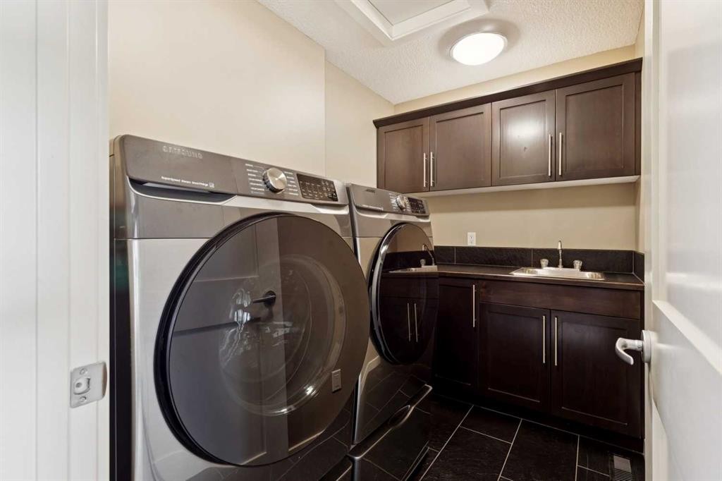44 Aspen Summit Drive Sw, Calgary, AB - Indoor Photo Showing Laundry Room
