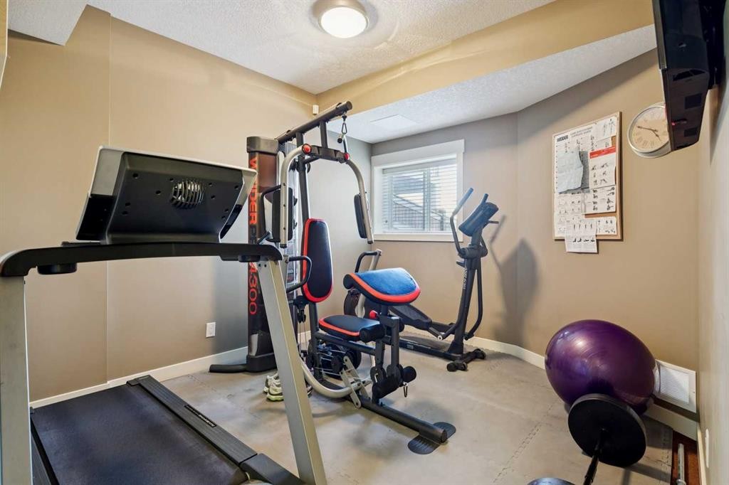 44 Aspen Summit Drive Sw, Calgary, AB - Indoor Photo Showing Gym Room
