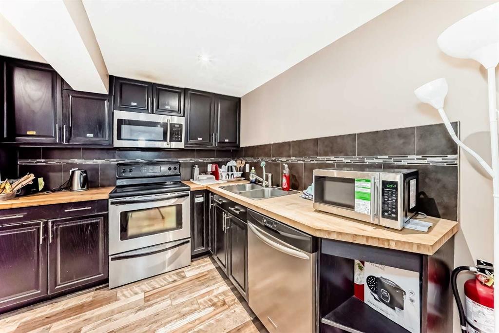 2508 Morley Trail Nw, Calgary, AB - Indoor Photo Showing Kitchen With Stainless Steel Kitchen With Double Sink