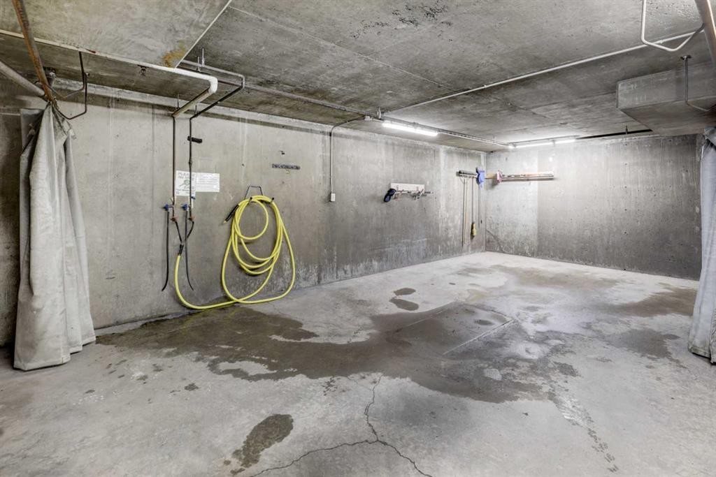101-6800 Hunterview Drive Nw, Calgary, AB - Indoor Photo Showing Garage