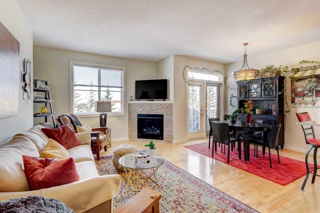 55 Tucker Circle, Okotoks, AB - Indoor Photo Showing Living Room With Fireplace