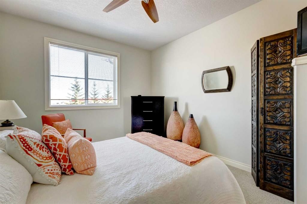 55 Tucker Circle, Okotoks, AB - Indoor Photo Showing Bedroom