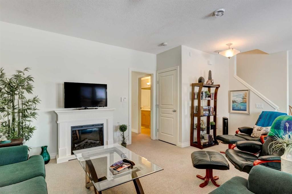 55 Tucker Circle, Okotoks, AB - Indoor Photo Showing Living Room With Fireplace