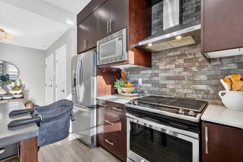 203-445 Redstone Walk Ne, Calgary, AB - Indoor Photo Showing Kitchen With Stainless Steel Kitchen With Upgraded Kitchen