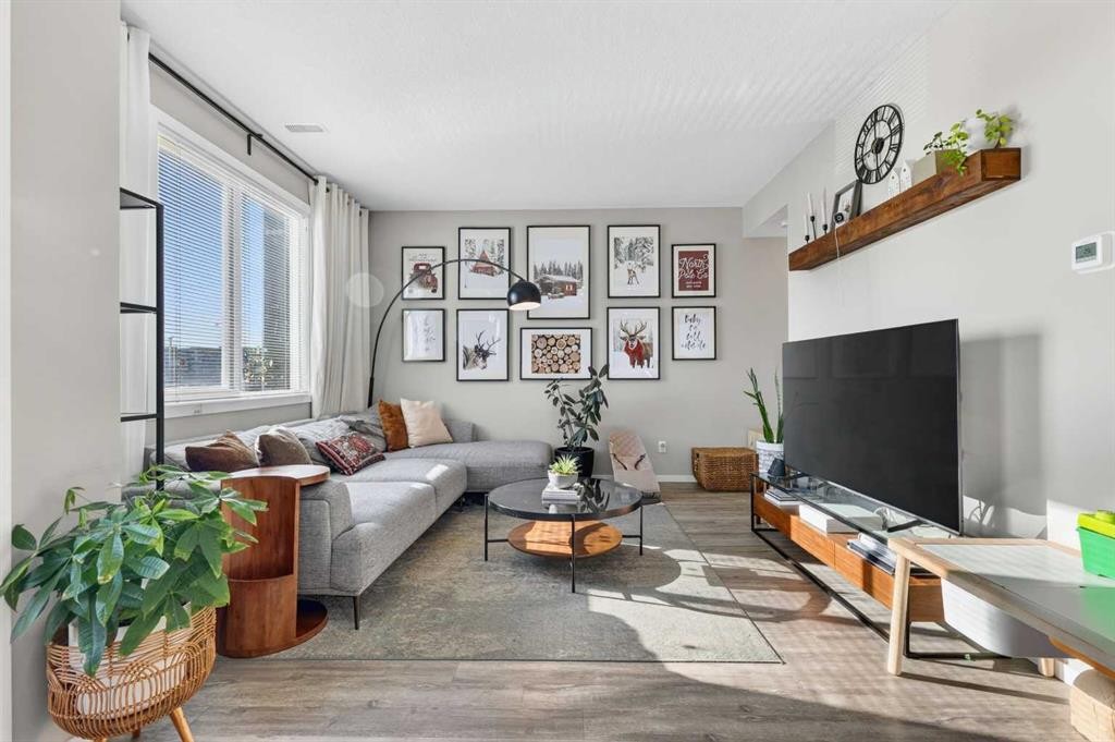 203-445 Redstone Walk Ne, Calgary, AB - Indoor Photo Showing Living Room