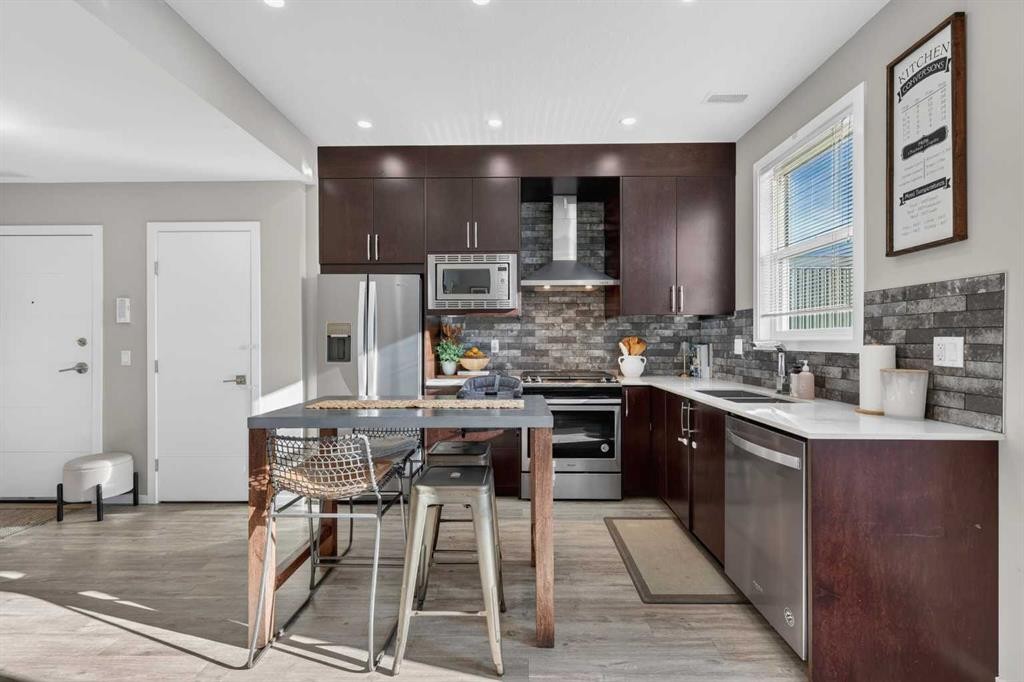 203-445 Redstone Walk Ne, Calgary, AB - Indoor Photo Showing Kitchen With Stainless Steel Kitchen With Double Sink With Upgraded Kitchen