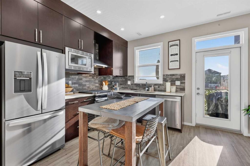 203-445 Redstone Walk Ne, Calgary, AB - Indoor Photo Showing Kitchen With Stainless Steel Kitchen With Upgraded Kitchen