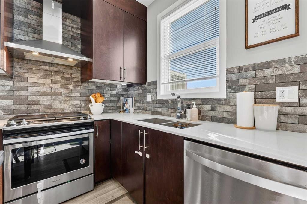 203-445 Redstone Walk Ne, Calgary, AB - Indoor Photo Showing Kitchen With Double Sink With Upgraded Kitchen