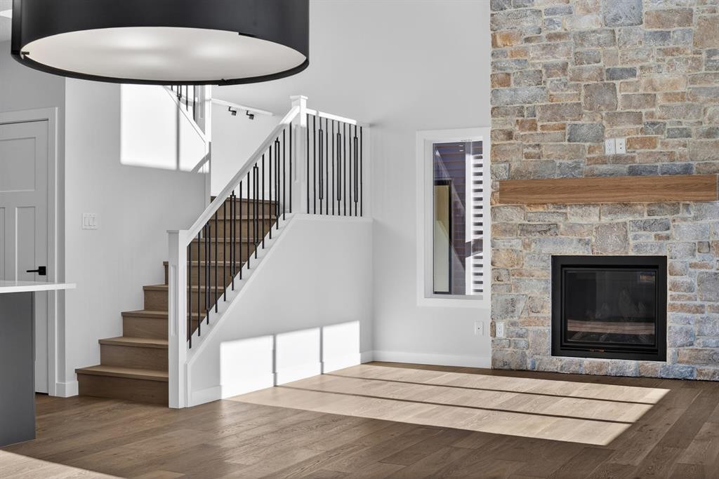 709 Dawson Common, Chestermere, AB - Indoor Photo Showing Other Room With Fireplace