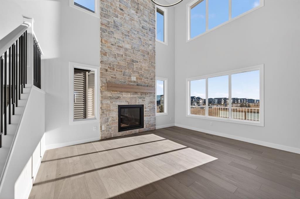 709 Dawson Common, Chestermere, AB - Indoor Photo Showing Living Room With Fireplace