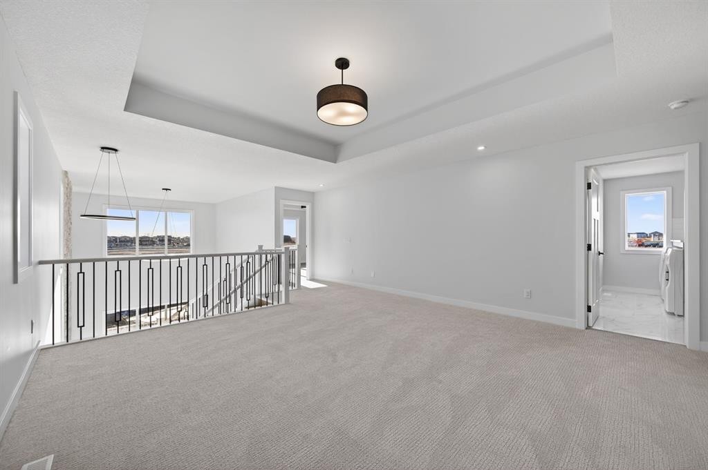 709 Dawson Common, Chestermere, AB - Indoor Photo Showing Other Room