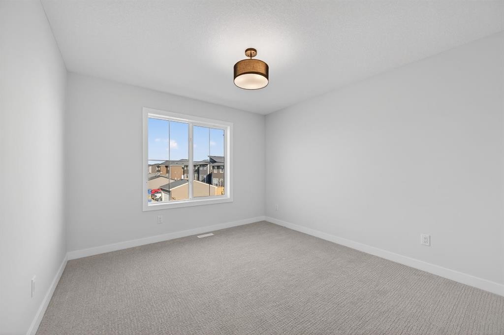709 Dawson Common, Chestermere, AB - Indoor Photo Showing Other Room