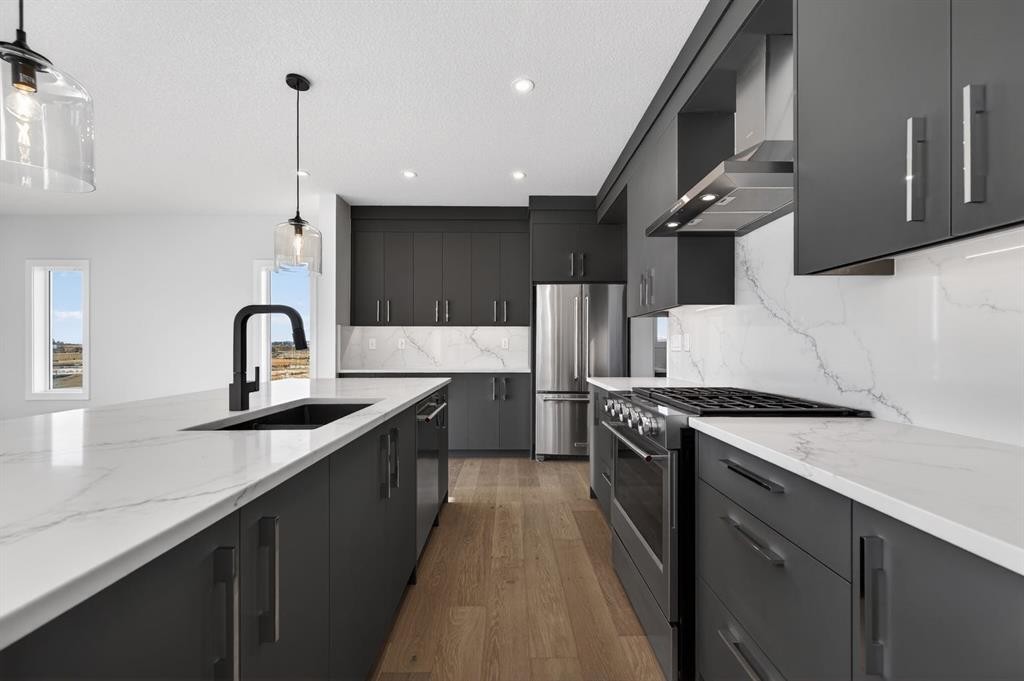 709 Dawson Common, Chestermere, AB - Indoor Photo Showing Kitchen With Upgraded Kitchen