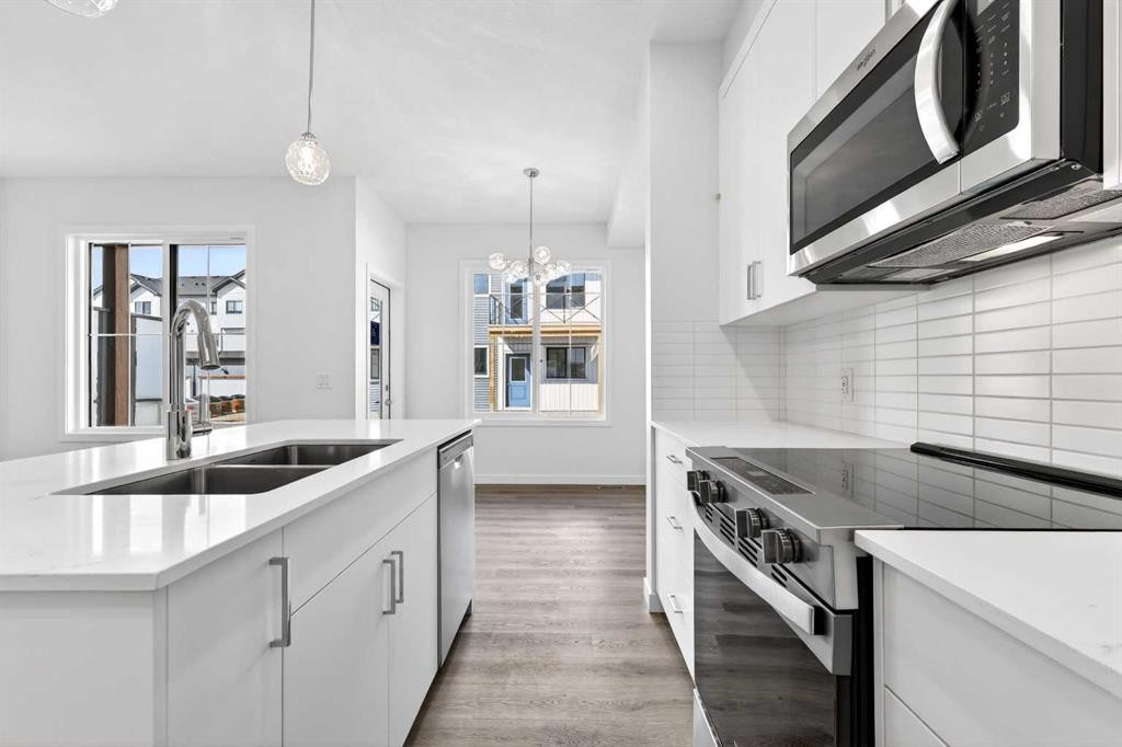 50 Creekside Way Sw, Calgary, AB - Indoor Photo Showing Kitchen With Double Sink With Upgraded Kitchen