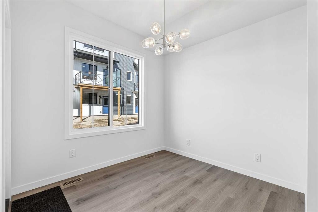 50 Creekside Way Sw, Calgary, AB - Indoor Photo Showing Other Room
