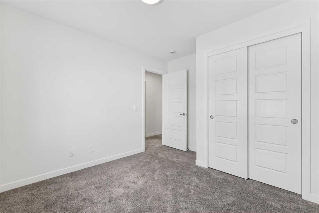 50 Creekside Way Sw, Calgary, AB - Indoor Photo Showing Other Room