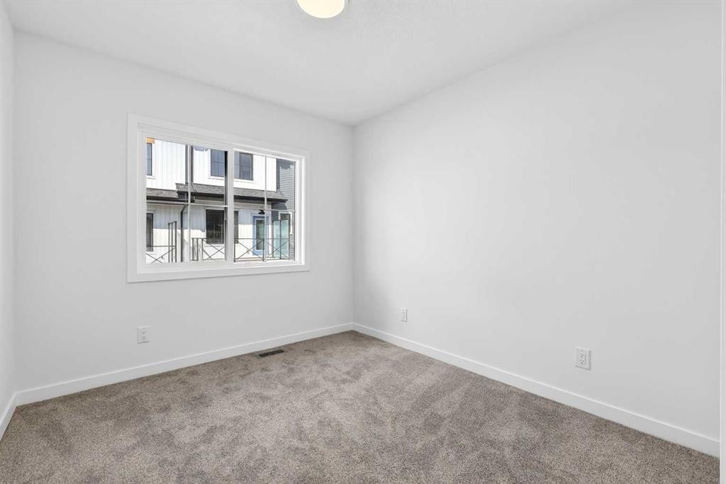 50 Creekside Way Sw, Calgary, AB - Indoor Photo Showing Other Room