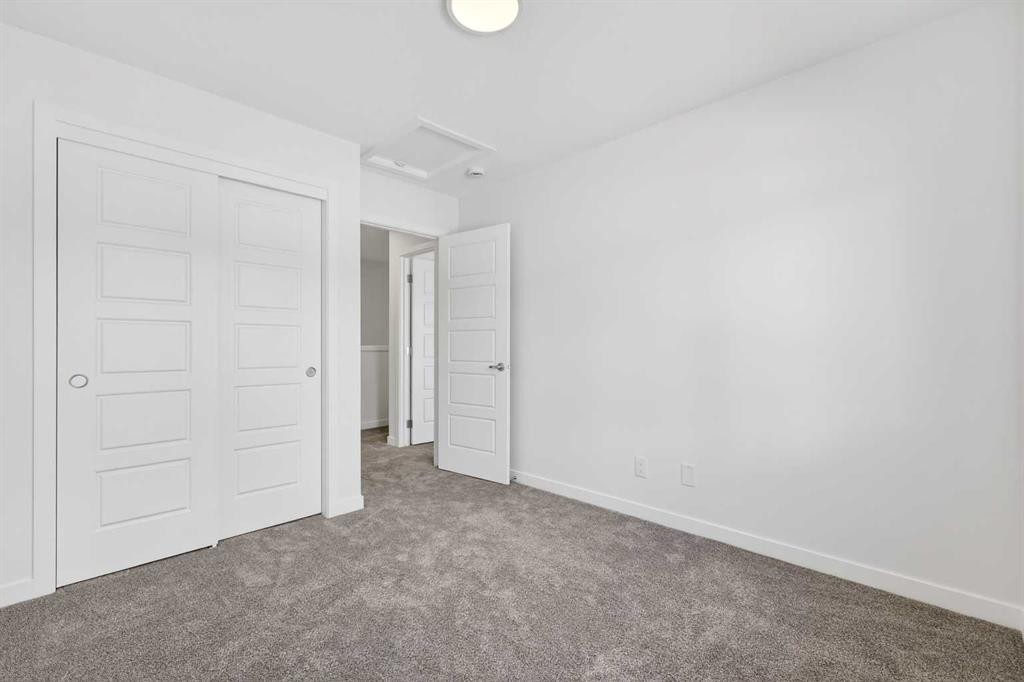 50 Creekside Way Sw, Calgary, AB - Indoor Photo Showing Other Room