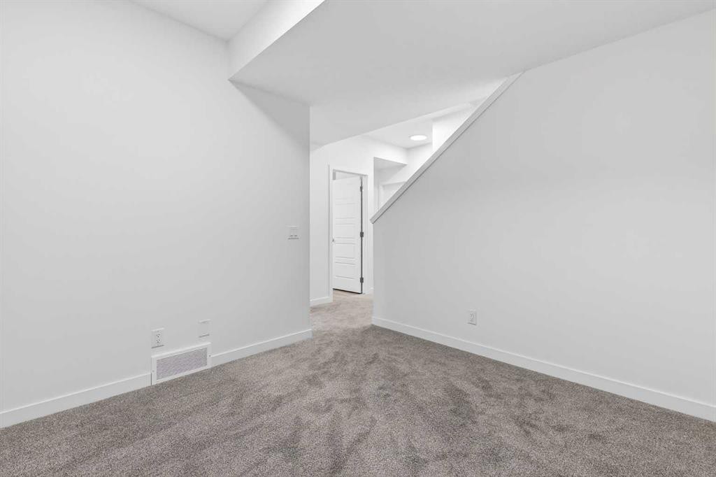 50 Creekside Way Sw, Calgary, AB - Indoor Photo Showing Other Room