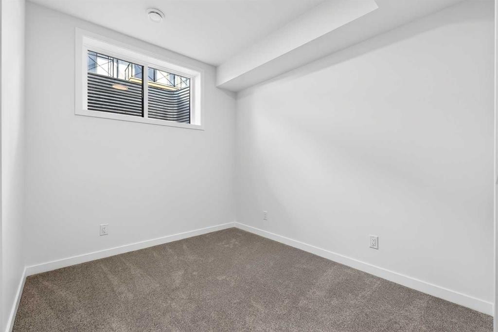 50 Creekside Way Sw, Calgary, AB - Indoor Photo Showing Other Room