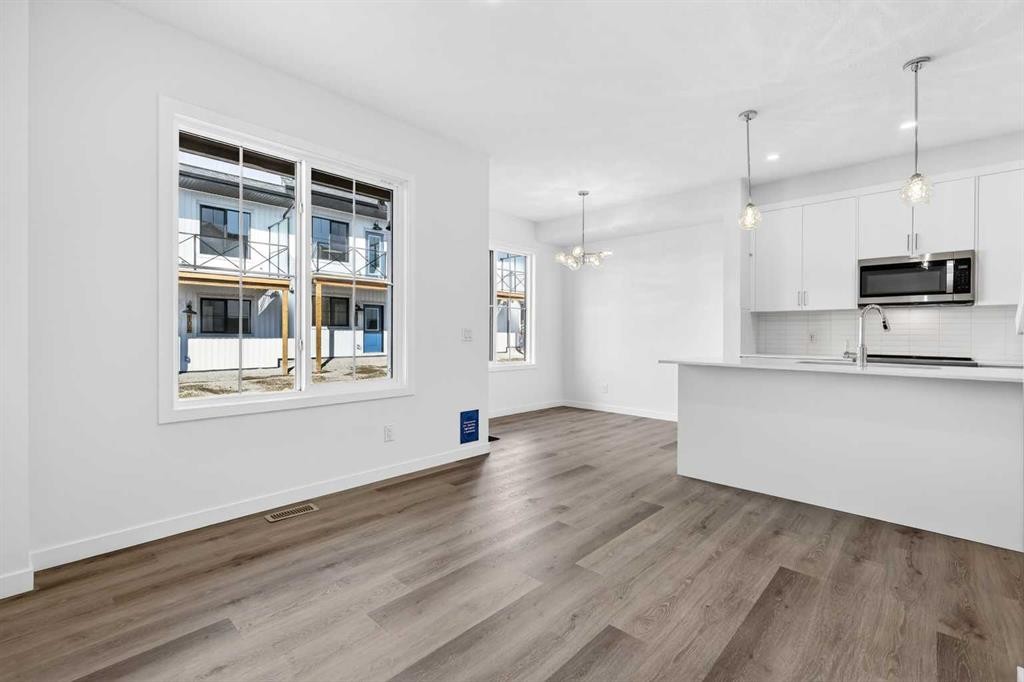 50 Creekside Way Sw, Calgary, AB - Indoor Photo Showing Kitchen With Upgraded Kitchen