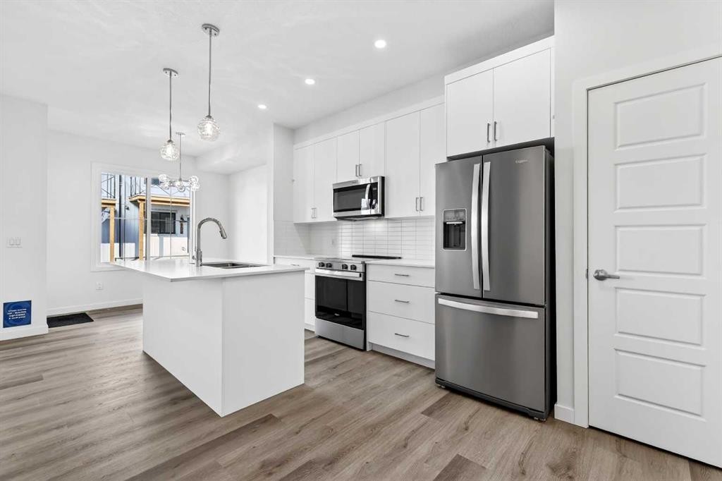 50 Creekside Way Sw, Calgary, AB - Indoor Photo Showing Kitchen With Stainless Steel Kitchen With Upgraded Kitchen