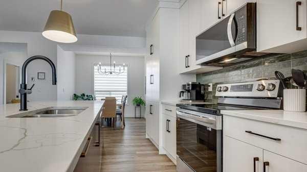 B-10 Evergreen Way, Red Deer, AB - Indoor Photo Showing Kitchen With Double Sink