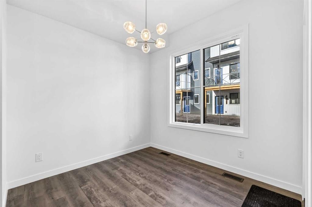 54 Creekside Way Sw, Calgary, AB - Indoor Photo Showing Other Room