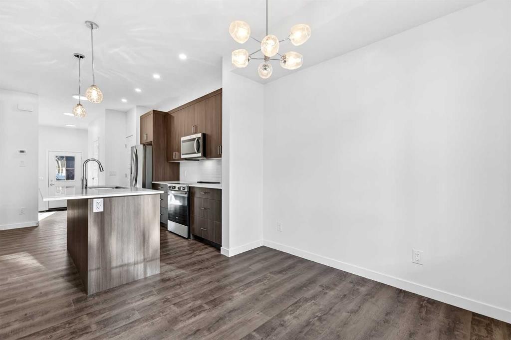 54 Creekside Way Sw, Calgary, AB - Indoor Photo Showing Kitchen With Stainless Steel Kitchen With Upgraded Kitchen