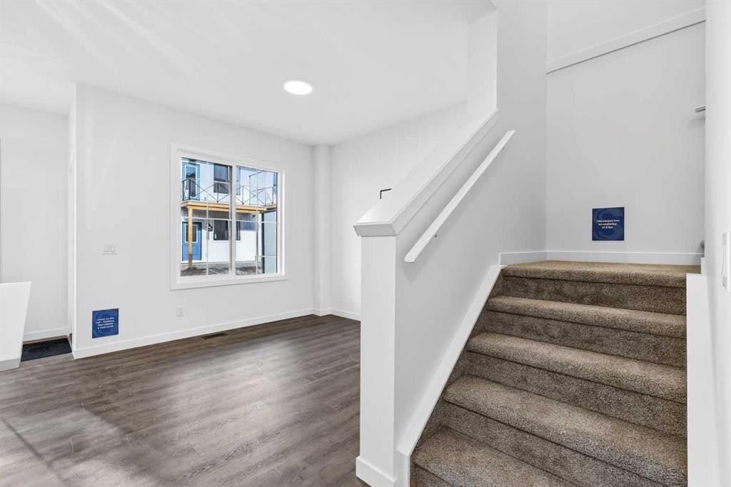 54 Creekside Way Sw, Calgary, AB - Indoor Photo Showing Other Room