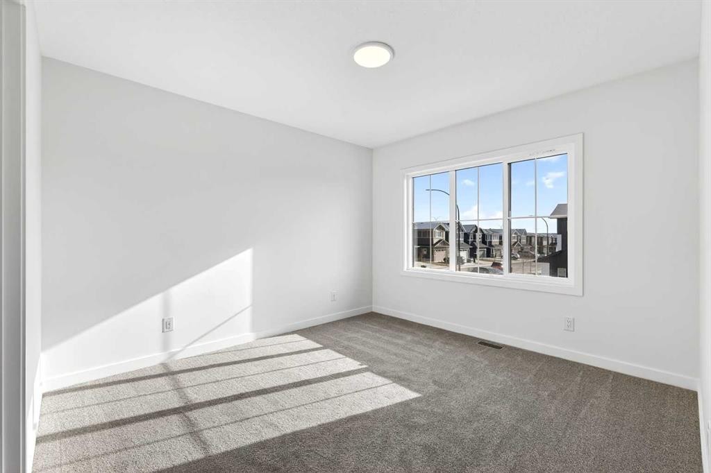 54 Creekside Way Sw, Calgary, AB - Indoor Photo Showing Other Room