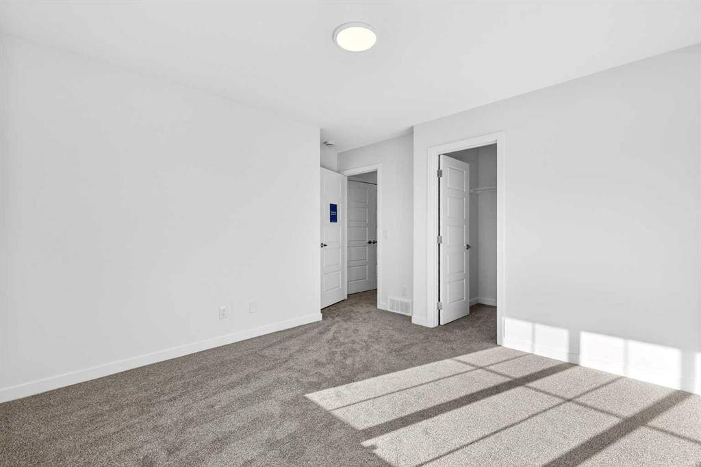 54 Creekside Way Sw, Calgary, AB - Indoor Photo Showing Other Room