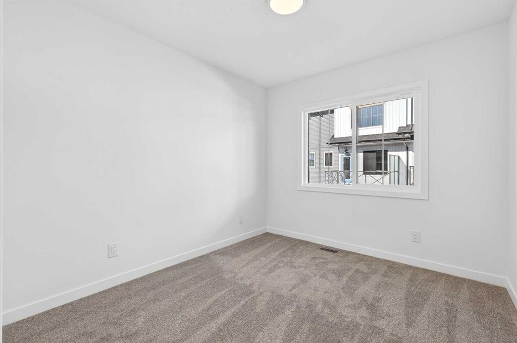 54 Creekside Way Sw, Calgary, AB - Indoor Photo Showing Other Room