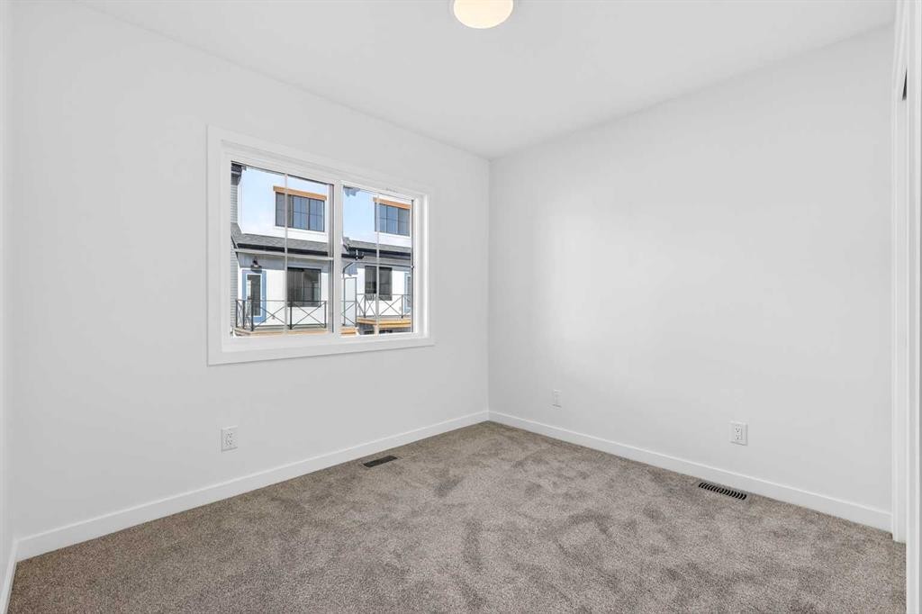 54 Creekside Way Sw, Calgary, AB - Indoor Photo Showing Other Room