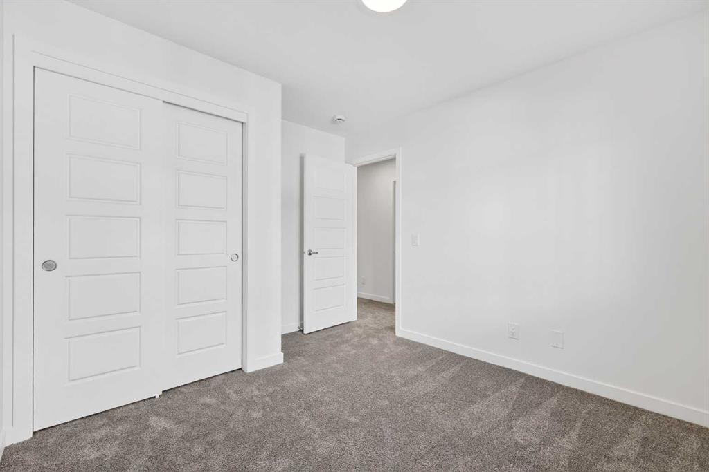 54 Creekside Way Sw, Calgary, AB - Indoor Photo Showing Other Room