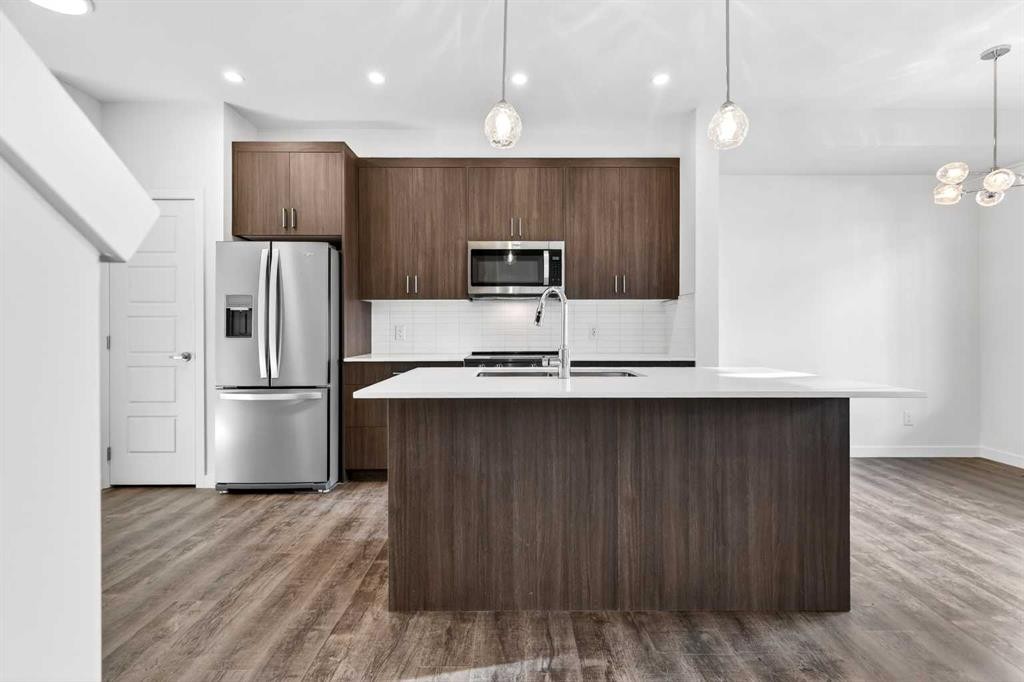 54 Creekside Way Sw, Calgary, AB - Indoor Photo Showing Kitchen With Stainless Steel Kitchen With Upgraded Kitchen