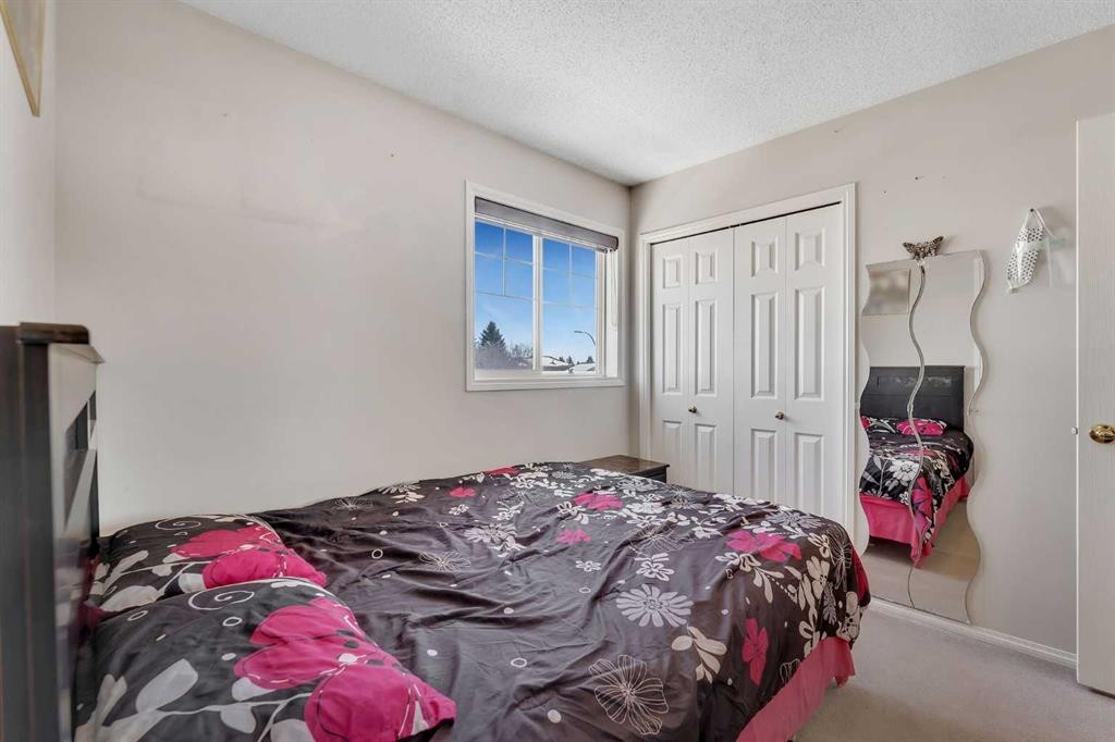 92 Taradale Drive Ne, Calgary, AB - Indoor Photo Showing Bedroom
