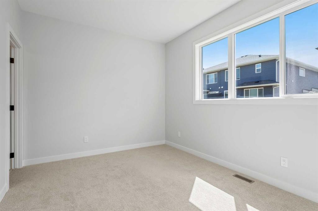 83 Dawson Wharf Mount, Chestermere, AB - Indoor Photo Showing Other Room