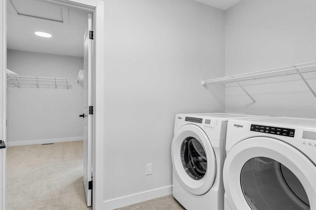 83 Dawson Wharf Mount, Chestermere, AB - Indoor Photo Showing Laundry Room