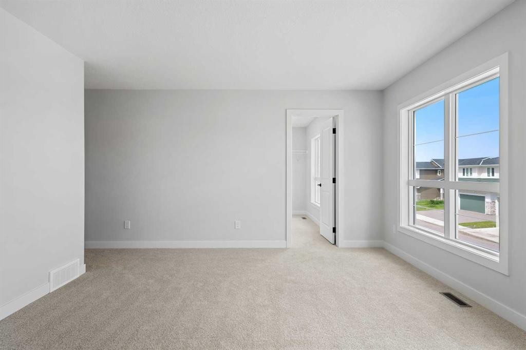83 Dawson Wharf Mount, Chestermere, AB - Indoor Photo Showing Other Room