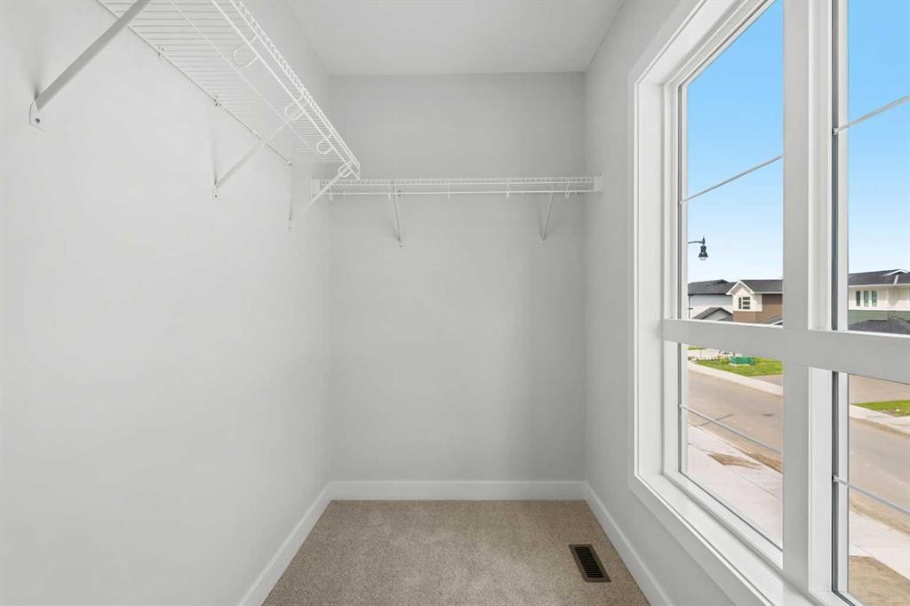 83 Dawson Wharf Mount, Chestermere, AB - Indoor With Storage