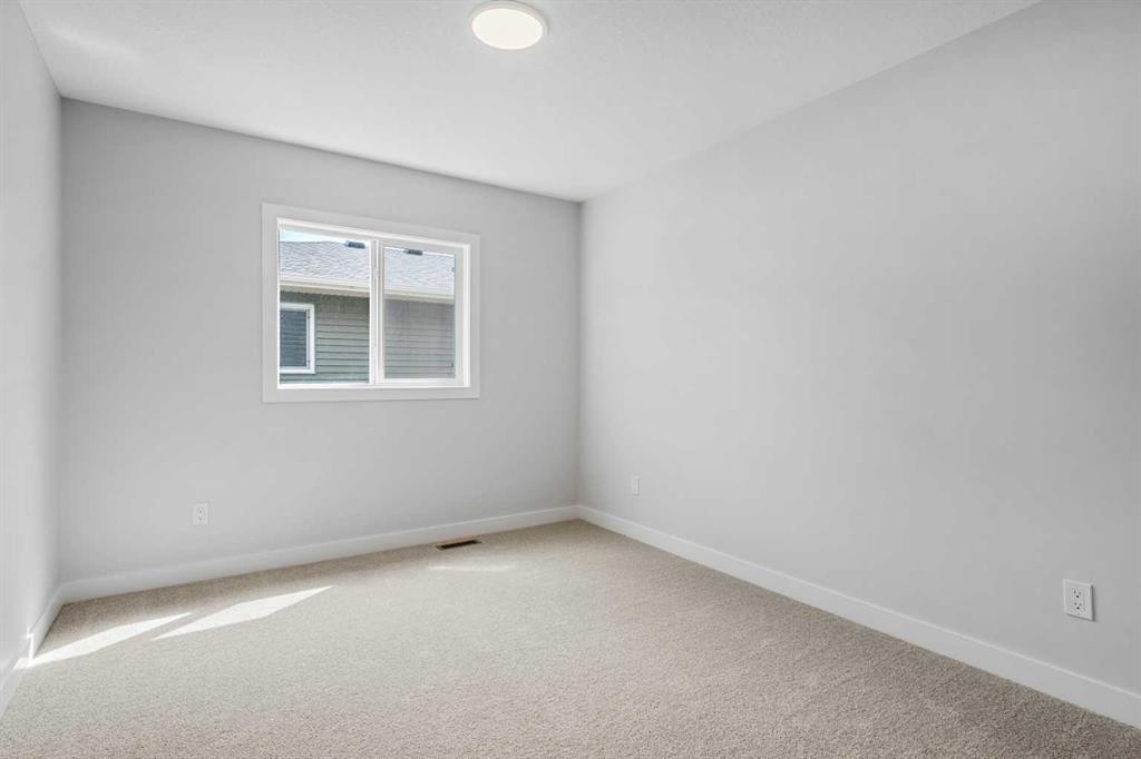 83 Dawson Wharf Mount, Chestermere, AB - Indoor Photo Showing Other Room