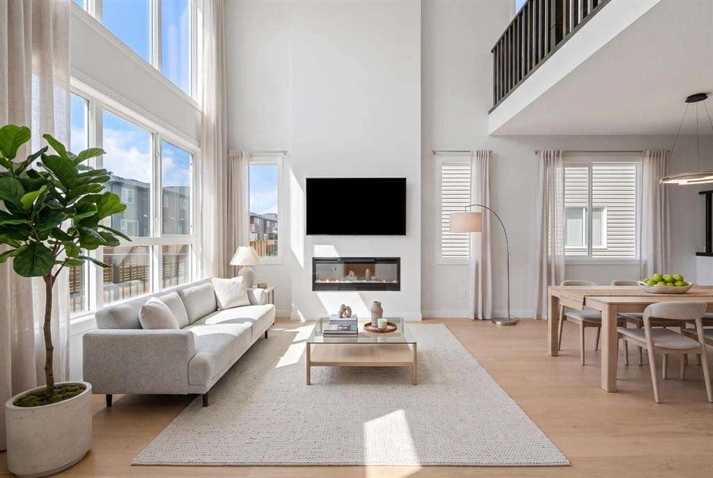 83 Dawson Wharf Mount, Chestermere, AB - Indoor Photo Showing Living Room With Fireplace