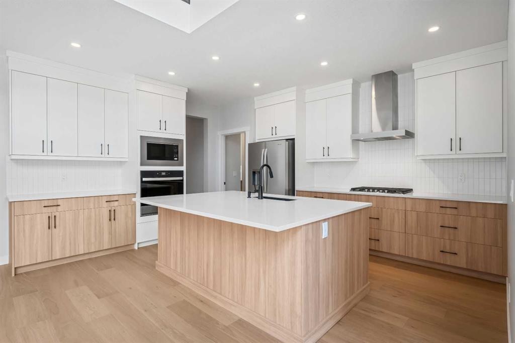 83 Dawson Wharf Mount, Chestermere, AB - Indoor Photo Showing Kitchen With Upgraded Kitchen