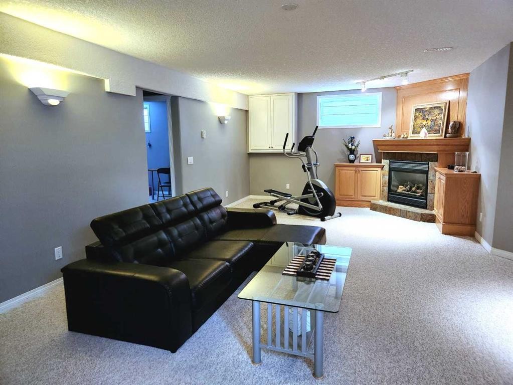 123 Schiller Crescent Nw, Calgary, AB - Indoor With Fireplace