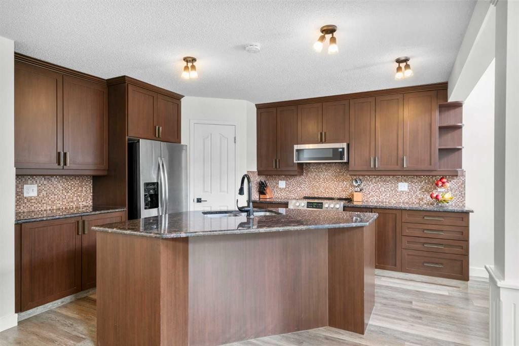 176 Douglas Ridge Green Se, Calgary, AB - Indoor Photo Showing Kitchen With Stainless Steel Kitchen With Upgraded Kitchen