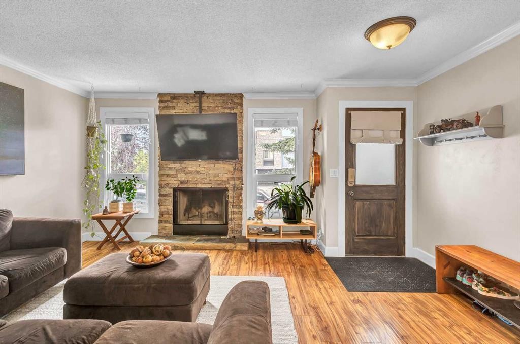 4532 Montgomery Avenue Nw, Calgary, AB - Indoor Photo Showing Living Room With Fireplace