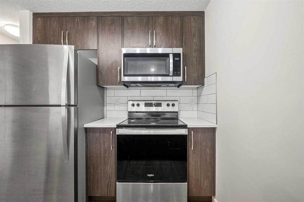 167 Cranbrook Square Se, Calgary, AB - Indoor Photo Showing Kitchen With Stainless Steel Kitchen