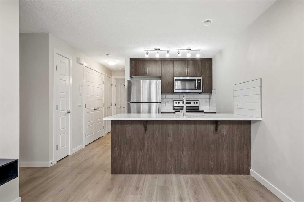167 Cranbrook Square Se, Calgary, AB - Indoor Photo Showing Kitchen With Upgraded Kitchen
